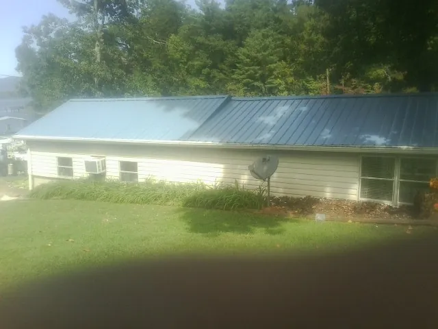 Blue metal roof running the length of a single story home in Chino Valley